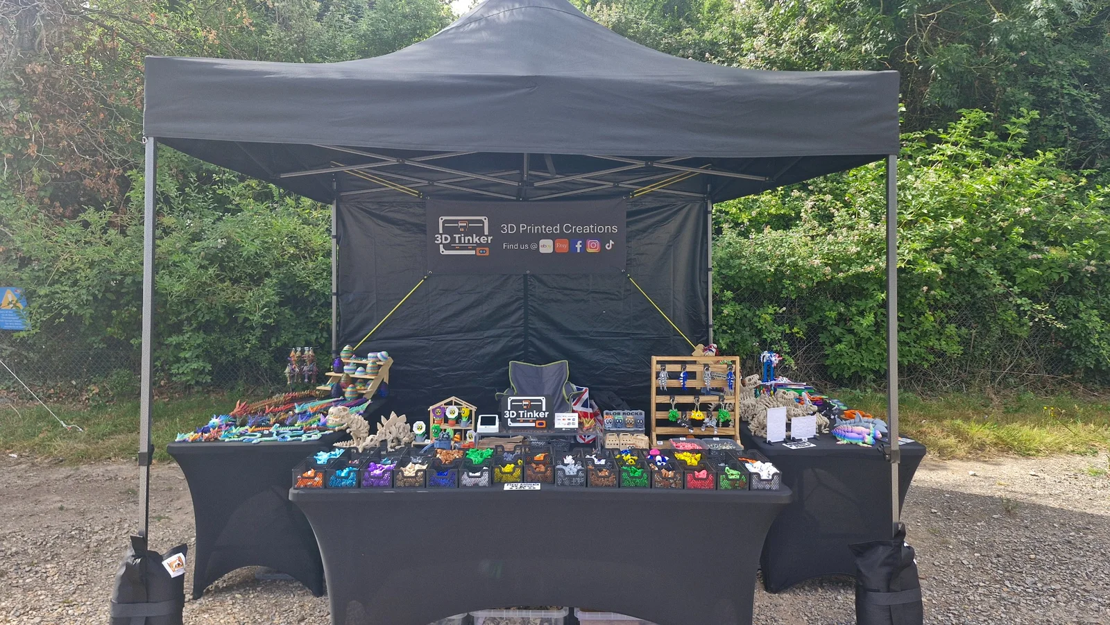 The 3D Tinker market stall filled with colourful 3D-printed toys and gifts